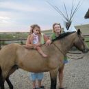 Kaylee on Little Buck with Grandma Paula and Mom Jenell